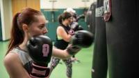 Student boxing in gym